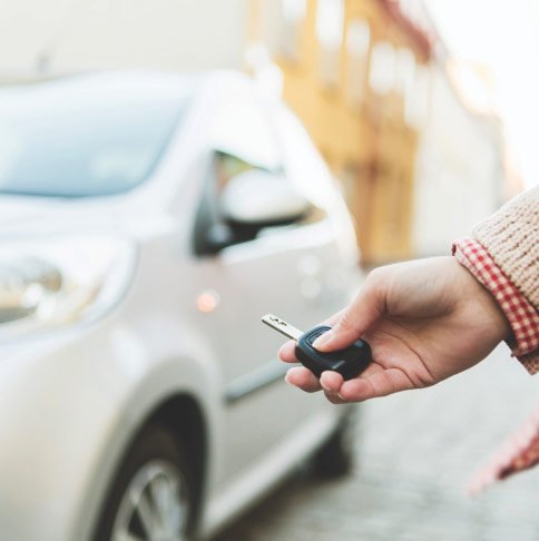 Person holding car keys.
