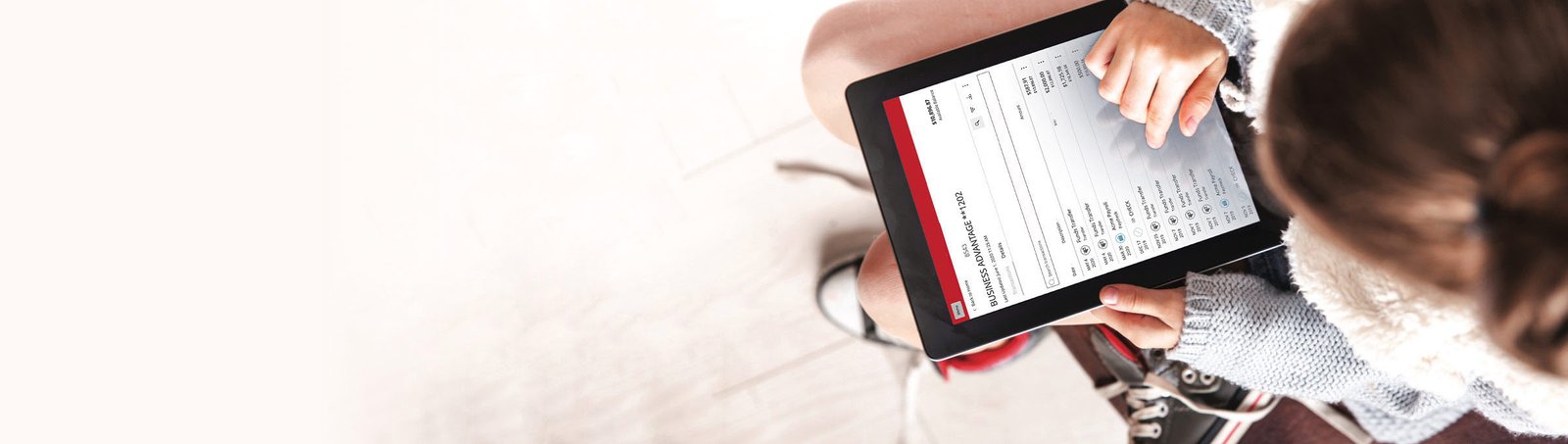 lite Valley Credit Union customer looking at their checking account on a tablet.